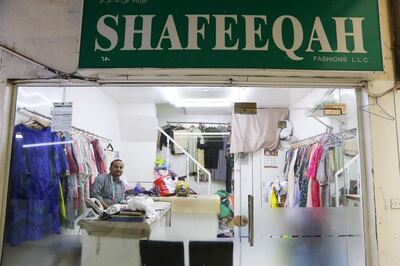 Master Mumtaz stitches women's clothing at the Shafeeqah Fashions, in Meena Bazaar, Bur Dubai. Pawan Singh / The National