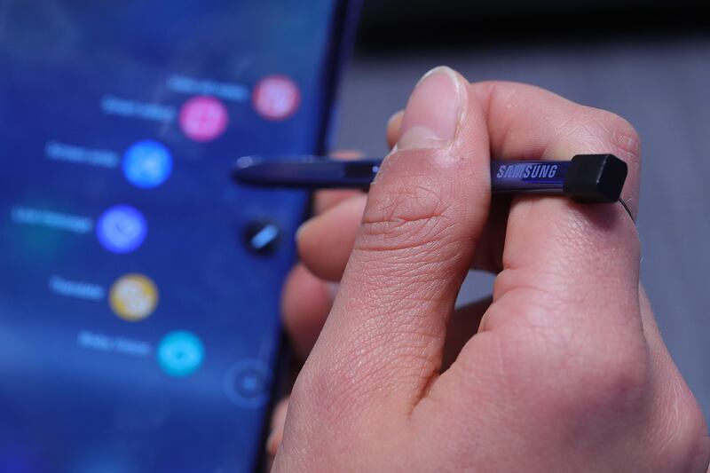 An attendee uses the S-Pen on a Samsung Electronics Co. Galaxy Note 8 smartphone at the IFA Consumer electronics show in Berlin, Germany, on Friday, Sept. 1, 2017. The IFA features 1,805 exhibitors from the global technology industry and runs to September 6. Photographer: Krisztian Bocsi/Bloomberg