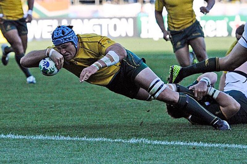James Horwill, the Australia captain, dives over the line for what would be the only try of the game as the Wallabies advance to the Rugby World Cup semi-finals.

Stephane de Sakutin / AFP