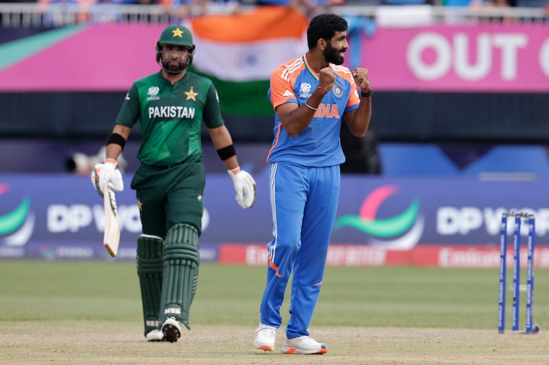 India's Jasprit Bumrah, right, celebrates the dismissal of Pakistan's Iftikhar Ahmed, left, during the ICC Men's T20 World Cup cricket match between India and Pakistan at the Nassau County International Cricket Stadium in Westbury, New York, Sunday, June 9, 2024.  (AP Photo / Adam Hunger)