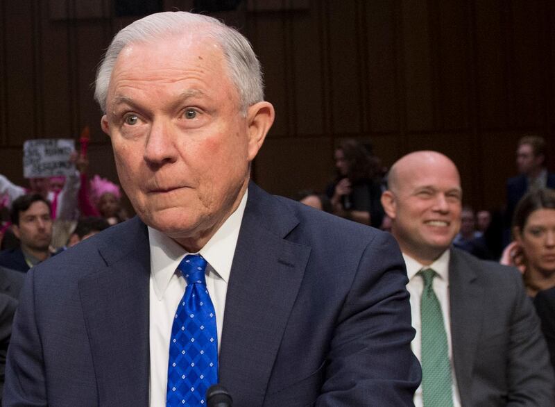 (FILES) In this file photo taken on October 18, 2017 US Attorney General Jeff Sessions arrives to testify as as Matthew G. Whitaker (R), Chief of Staff to Attorney General Jeff Sessions smiles during a Senate Judiciary Committee hearing on Capitol Hill in Washington, DC. US attorney general Jeff Sessions said he is resigning at Trump's request on November 7, 2018. Matthew G. Whitaker will be the new Acting Attorney General. - 
 / AFP / Saul LOEB
