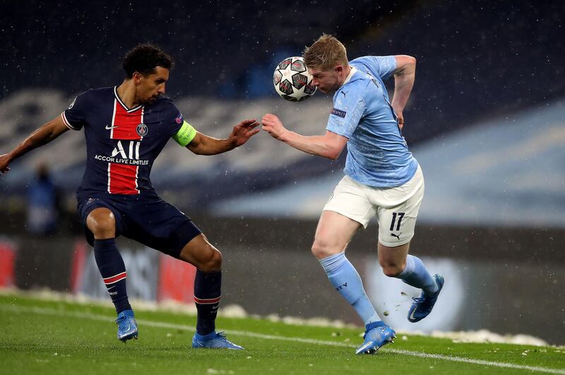 Paris Saint-Germain's Marquinhos and Manchester City's Kevin De Bruyne battle for the ball during their Champions League semi-final second leg at the Etihad Stadium on May 4, 2021. PA