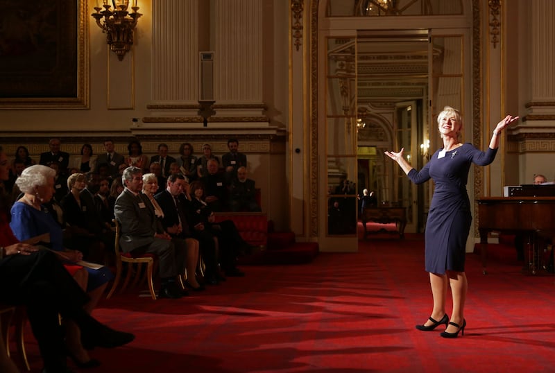 Queen Elizabeth watches Dame Helen Mirren delivering a speech from Shakespeare's 'The Tempest' at a dramatic arts reception in the ballroom of the Buckingham Palace in 2014. Getty Images