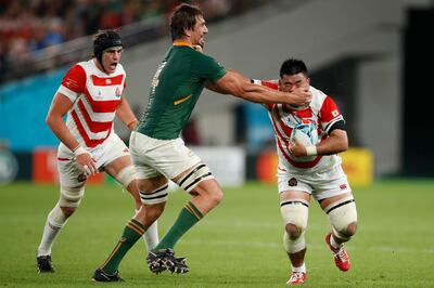 South Africa's lock Eben Etzebeth tackles Japan's prop Koo Ji-won (R) during the Japan 2019 Rugby World Cup quarter-final match between Japan and South Africa at the Tokyo Stadium in Tokyo on October 20, 2019. / AFP / Odd Andersen
