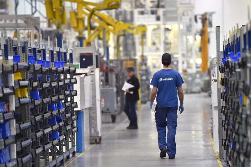 An employee of the civil aircraft manufacturing company Airbus works on March 20, 2017 at the Airbus facility in Bouguenais, western France. (Photo by LOIC VENANCE / AFP)