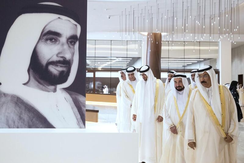 Sheikh Mohammed bin Zayed, Crown Prince of Abu Dhabi and Deputy Supreme Commander of the Armed Forces, views an exhibit during the inauguration of the Etihad Museum on the UAE’s 45th National Day. Seen with Mohamed Al Murr, former Speaker of the UAE Federal National Council (FNC) (R), Dr Sheikh Sultan bin Mohammed Al Qasimi, Ruler of Sharjah, Sheikh Saud bin Saqr Al Qasimi, Ruler of Ras Al Khaimah, Sheikh Humaid bin Rashid Al Nuaimi, Ruler of Ajman, Sheikh Hamad bin Mohammed Al Sharqi, Ruler of Fujairah, Sheikh Saud bin Rashid Al Mu’alla, Ruler of Umm Al Quwain and Sheikh Humaid bin Rashid Al Nuaimi, Ruler of Ajman. Ryan Carter / Crown Prince Court — Abu Dhabi