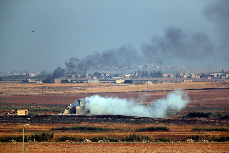 In this photo taken from the Turkish side of the border between Turkey and Syria, in Akcakale, Sanliurfa province, southeastern Turkey, smoke billows from targets inside Syria during bombardment by Turkish forces. AP Photo