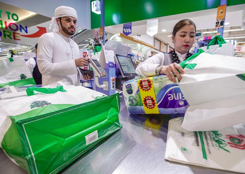 Abu Dhabi, United Arab Emirates, March 10, 2020. 
Lulu Hypermarket going plastic bag free and cleanliness-conscious to combat the Covid-19 outbreak.  Rashid Awad checking out using  reusable grocery bags.
Victor Besa / The National
Section:  NA
Reporter:  Haneen Dajani