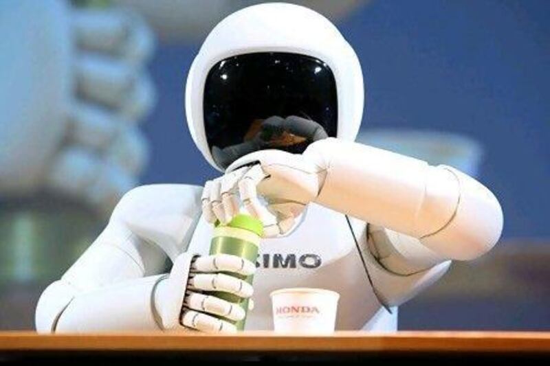 Honda's Asimo robot not only serves tea but can gather and process enough information to trigger autonomous behaviour. Tomohiro Ohsumi / Bloomberg News