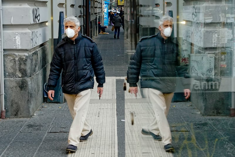 Naples, Italy. More EU countries now require people to wear FFP2 multi-layered face masks outdoors to curb the spread of the more contagious Omicron coronavirus strain. EPA