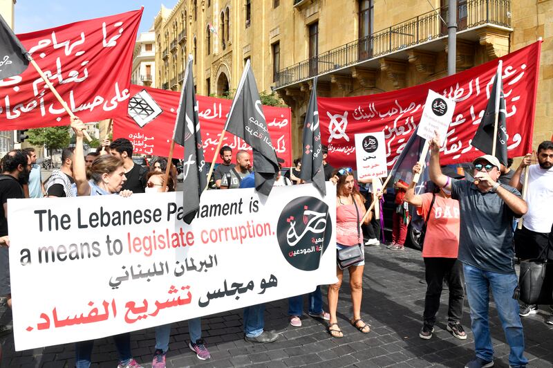 People protest against a draft capital control law, outside Lebanon's Parliament in downtown Beirut, on Tuesday.  EPA