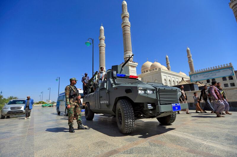 Fighters loyal to Yemen's Houthi rebels march outside al-Saleh grand mosque in Sana'a, Yemen. AFP