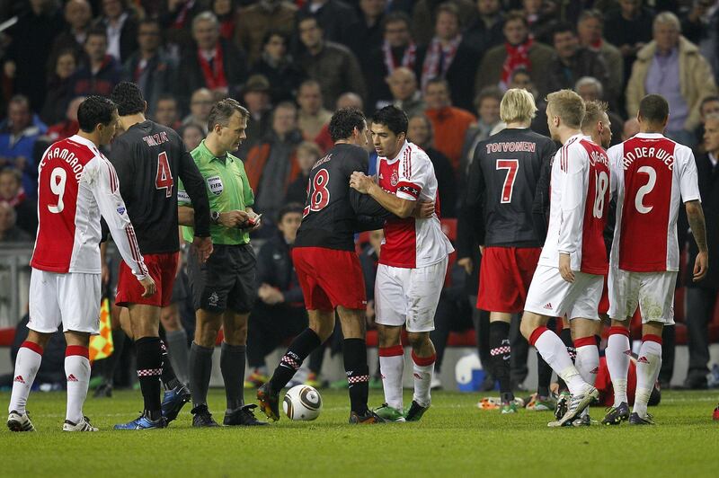 Ajax captain Luis Suarez was not sent off the pitch but later has accepted a seven-match ban for biting PSV Eindhoven midfielder Otman Bakkal's shoulder during the Dutch Eredivisie match between Ajax Amsterdam and PSV Eindhoven at the Amsterdam Arena on November 20, 2011 at Amsterdam, Netherlands. (Photo by VI Images via Getty Images)