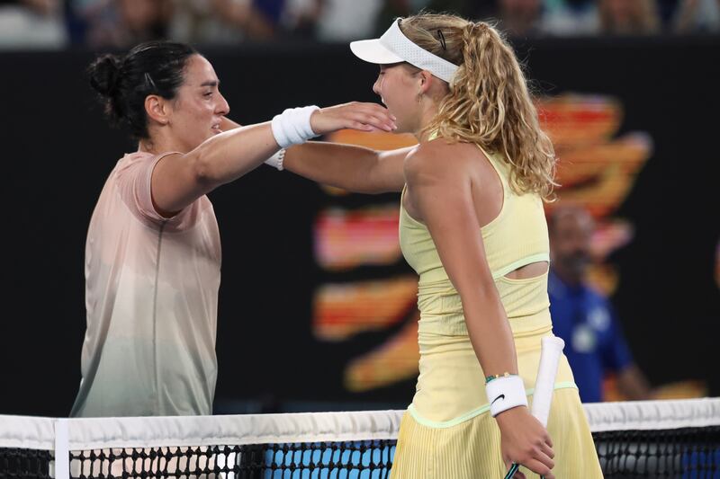 Ons Jabeur and Mirra Andreeva greet each other at the net after their second-round match at the Australian Open. AP