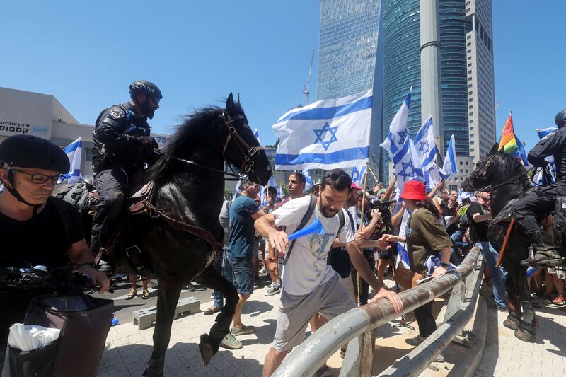 Police and protesters clash on the 'Day of Disruption' opposing the judicial overhaul, in Tel Aviv. Reuters