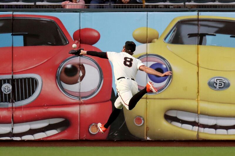 San Francisco Giants left fielder Hunter Pence attempts to catch the ball in the first inning of a baseball game in San Francisco. Scot Tucker/AFP