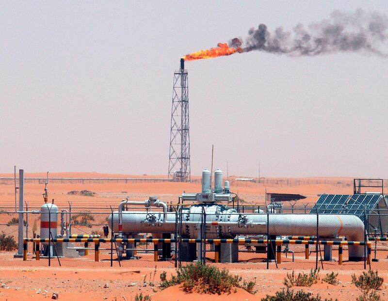 epa07569526 (FILE) - An image showing a gas flame behind pipelines in the desert at Khurais oil field, about 160 km from Riyadh, Kingdom of Saudi Arabia, 23 June 2008 (reissued 14 May 2019). Reports on 14 May 2019 state Saudi Aramco said some of its oil infrastructure in Saudi Arabia's eastern province has been attacked, including one of its petroleum pumping stations that was targeted by apparent armed drone attack.  EPA/ALI HAIDER *** Local Caption *** 90020213