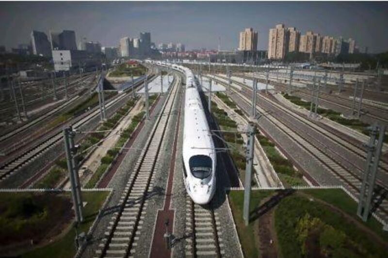 A CRH high-speed train leaves the Beijing South Station for Shanghai on the Beijing-Shanghai high-speed railway yesterday. Alexander Yuan / AP Photo