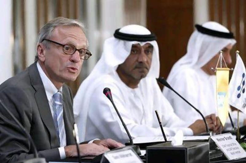 From left to right: Werner Brandt, the chief financial officer and an executive board member at S&P, Sheikh Ahmed bin Saeed Al Maktoum, the chairman of Dubai Silicon Oasis Authority, and Mohammed Al Zarooni, the vice president and chief executive of of Dubai Silicon Oasis. Antoine Robertson / The National