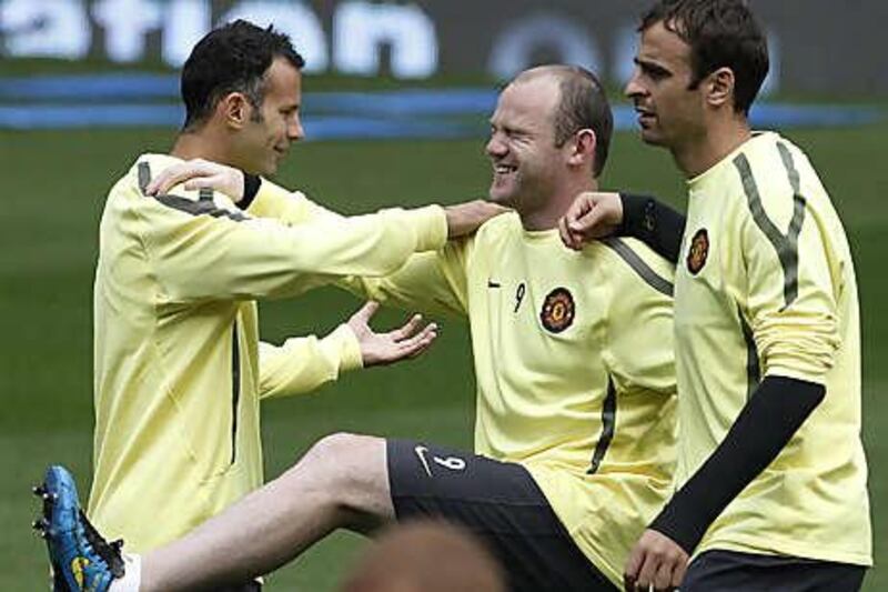 Manchester United's attacking trio of Ryan Giggs, left, Wayne Rooney, centre, and Dimitar Berbatov at Old Trafford in 2010.