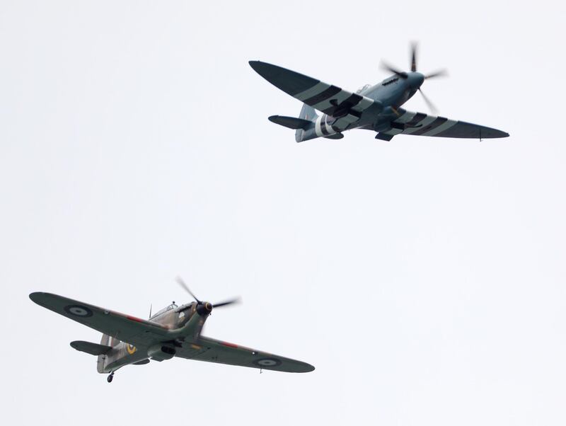 A flypast by WWII fighter aircraft, a Spitfire (top) and Hurricane (bottom), during the commemorations for the 75th Anniversary of the D-Day landings in Southsea Common, Portsmouth, Hampshire.  EPA