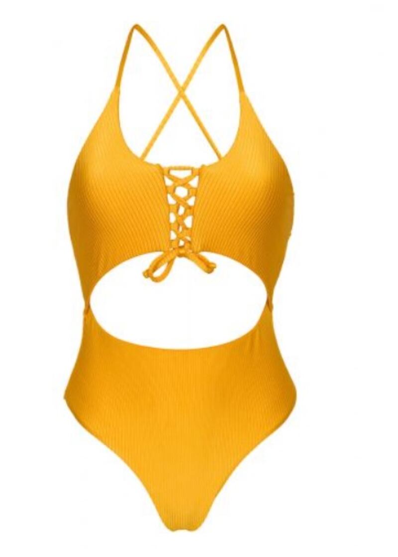 In cheery sunshine yellow, Rio de Sol Eden-pequi ivy strap one-piece is made from textured material, with the addition of bust detail and halter neck straps to the on-trend cut-out style; Dh299, Rio de Sol at brazilianbikinishop.com. Photo: Brazilian Bikini Shop