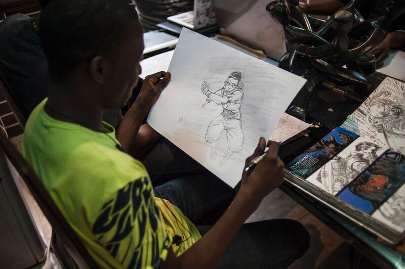 An illustrator looks at a sketch at the Comic Republic office. Stefan Heunis / AFP