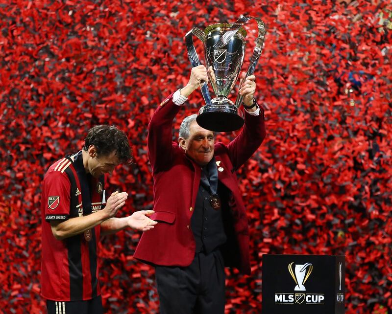 Atlanta United owner Arthur Blank lifts the MLS Cup. Reuters
