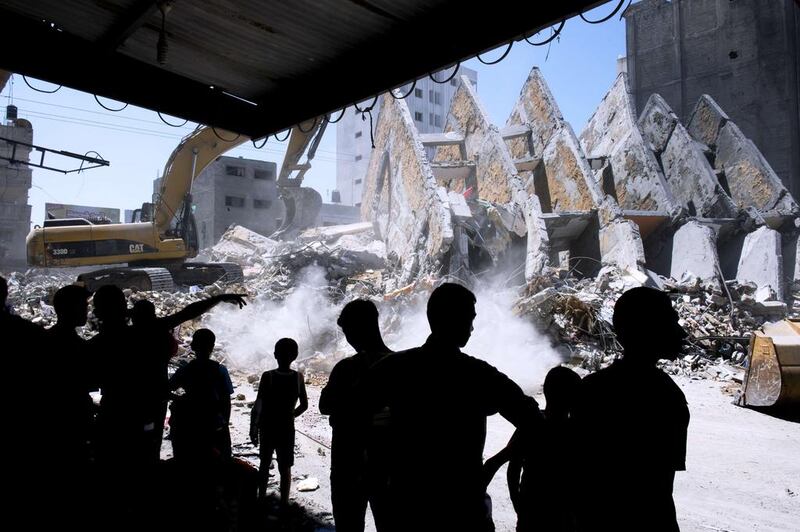 One witness said residents had fled the building after the Israeli army sent them pre-recorded warning messages. Roberto Schmidt/AFP Photo