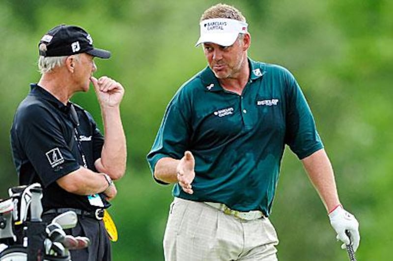 Darren Clarke, right, shares a joke with Pete Cowen, his swing coach, have a chat during the pro-am prior to the Irish Open last week in Killarney.