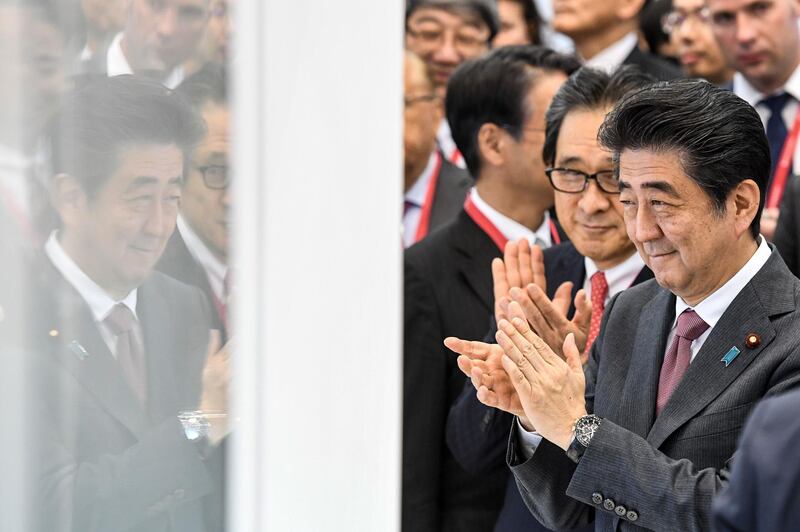 Japanese Prime Minister Shinzo Abe visits the stand of Japan at the Saint Petersburg International Economic Forum in Saint Petersburg. AFP / Kirill KUDRYAVTSEV