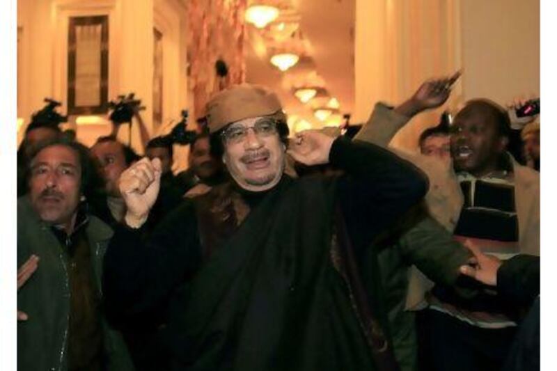 Libya's leader Muammar Gaddafi arrives to give television interviews at a hotel in Tripoli.