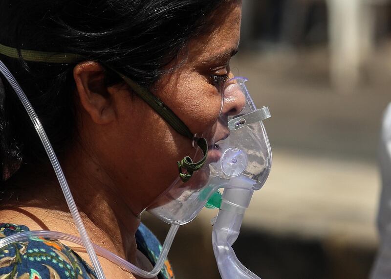 A suspected Covid-19 positive patient receives oxygen treatment at the Covid-19 hospital Ahmedabad, India. EPA