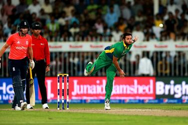 SHARJAH, UNITED ARAB EMIRATES - NOVEMBER 30: Shahid Afridi of Pakistan bowls as Eoin Morgan of England looks on during the 3rd International T20 match between Pakistan and England at Sharjah Cricket Stadium on November 30, 2015 in Sharjah, United Arab Emirates. (Photo by Neville Hopwood/Getty Images)