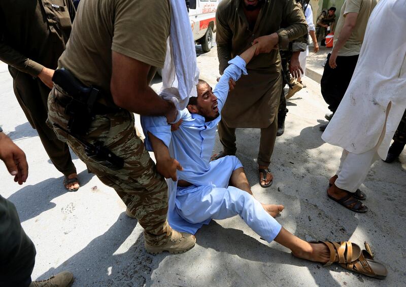 A man reacts after an attack in Jalalabad city, Afghanistan July 11, 2018.   REUTERS/Parwiz