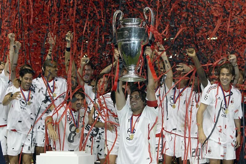 AC Milan captain Paolo Maldini lifts the Champions League trophy, after defeating Juventus on penalties in Manchester, May 2003. All photos: Getty Images