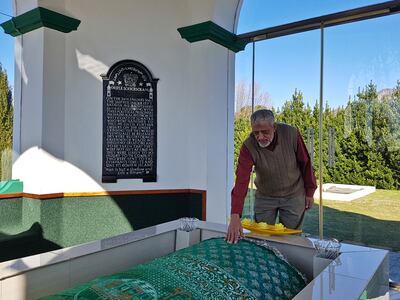 Mahmood Limbada, Chairman of the Cape Mazaar Society, pays tribute at the kramat of Sayed Mahmud. Photo: Richard Holmes