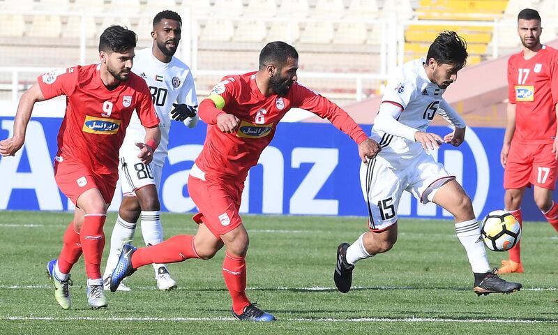 Al Jazira, in white, proved tough competitors for Tractor Sazi on Tuesday. Al Jazira