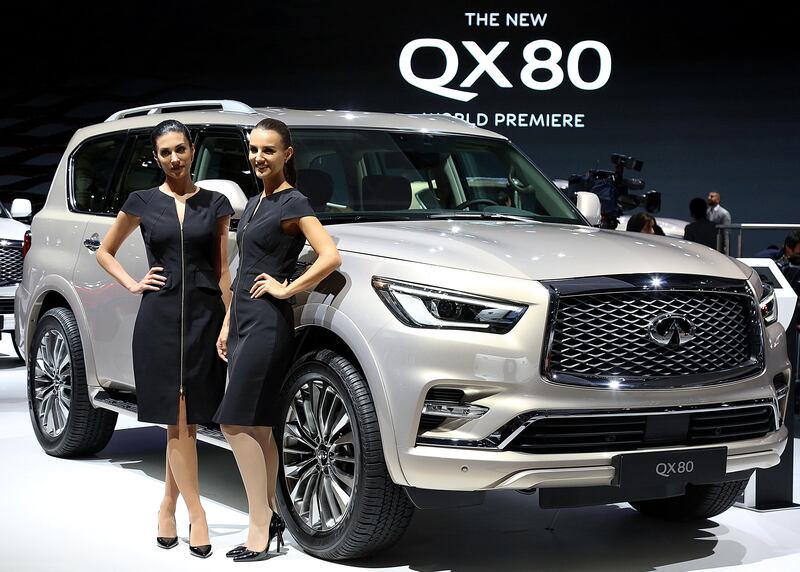 Dubai, 14, Nov, 2017: Models pose in front of the new Infinity QX 80 car at the Dubai International Motor Show in Dubai. Satish Kumar for the National / Story by Adam Workman