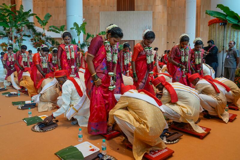 Underprivileged couples take part in a mass wedding organised by Chairman of Reliance Industries Limited Mukesh Ambani, in Navi Mumbai, India. AP