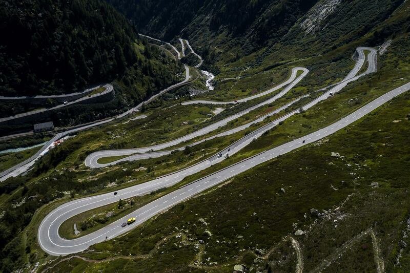 This aerial picture shows bicycles, motorcycle and car making their way to the Grimsel Pass, a mountain pass crossing the Swiss Alps at an elevation of 2,164 metres. Fabrice Coffrini/AFP