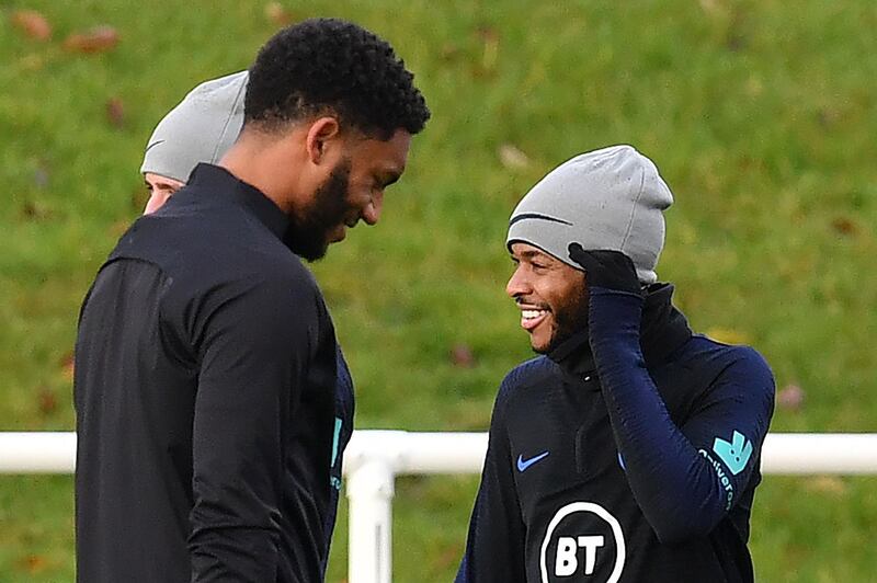 England's defender Joe Gomez (L) and England's midfielder Raheem Sterling attend an England team training session at St George's Park in Burton-on-Trent, central England on November 12, 2019, ahead of their Euro 2020 football qualification match against Montenegro.  - NOT FOR MARKETING OR ADVERTISING USE / RESTRICTED TO EDITORIAL USE 
 / AFP / Paul ELLIS / NOT FOR MARKETING OR ADVERTISING USE / RESTRICTED TO EDITORIAL USE 
