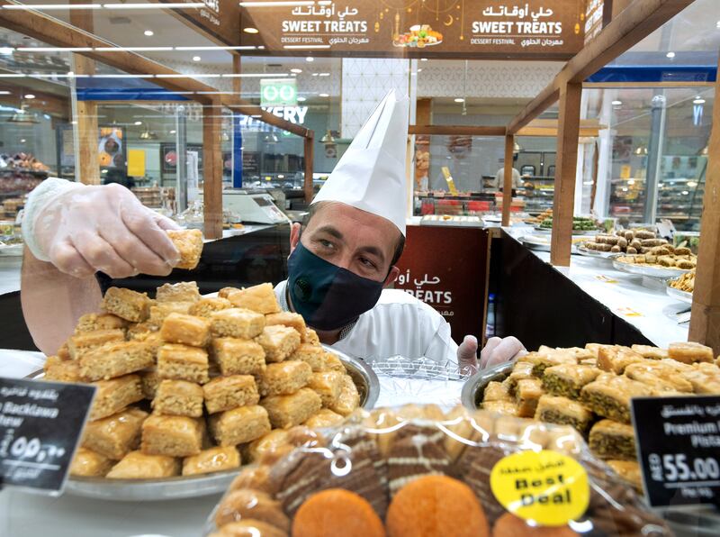 A baker prepares some Eid Al Adha sweets in Khalidiyah Mall, Abu Dhabi.