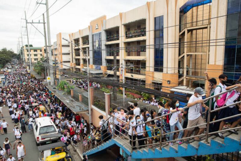 Pupils walk to school in Quezon city. Bloomberg