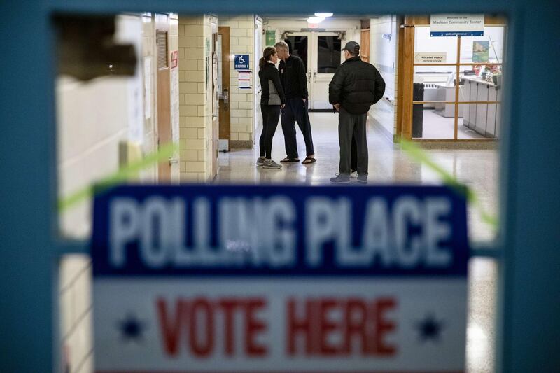 Voters wait outside a gymnasium for polls to open in the Madison Community Center polling place in Arlington, Virginia. AFP