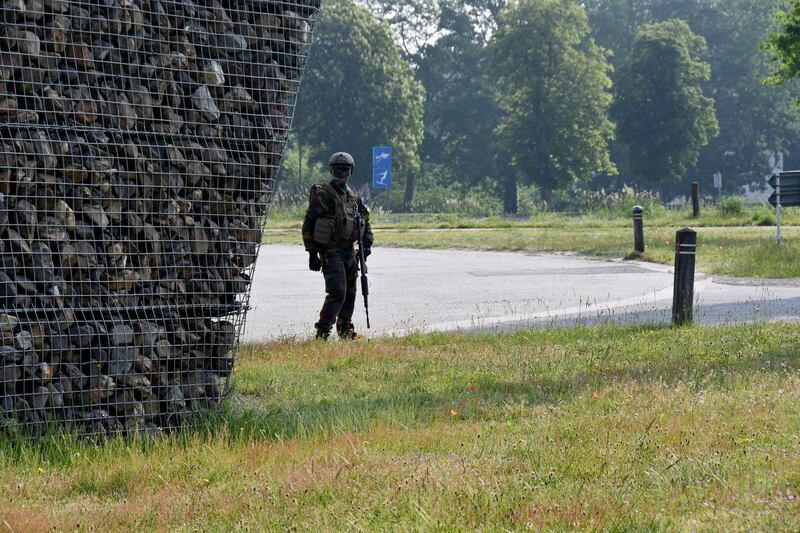 Soldiers search around the Hoge Kempen National Park on June 4. Conings was thought to be carrying a rocket launcher, a sub-machinegun, a bulletproof vest and a pistol, and had stolen weapons from a barracks. AFP