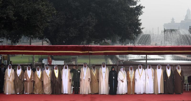 The delegation accompanying Sheikh Mohammed bin Zayed, Crown Prince of Abu Dhabi and Deputy Supreme Commander of the Armed Forces, stands for the national anthems of the UAE and India during a ceremonial reception at the Presidential Palace in New Delhi, India, on Wednesday. Manish Swarup / AP Photo