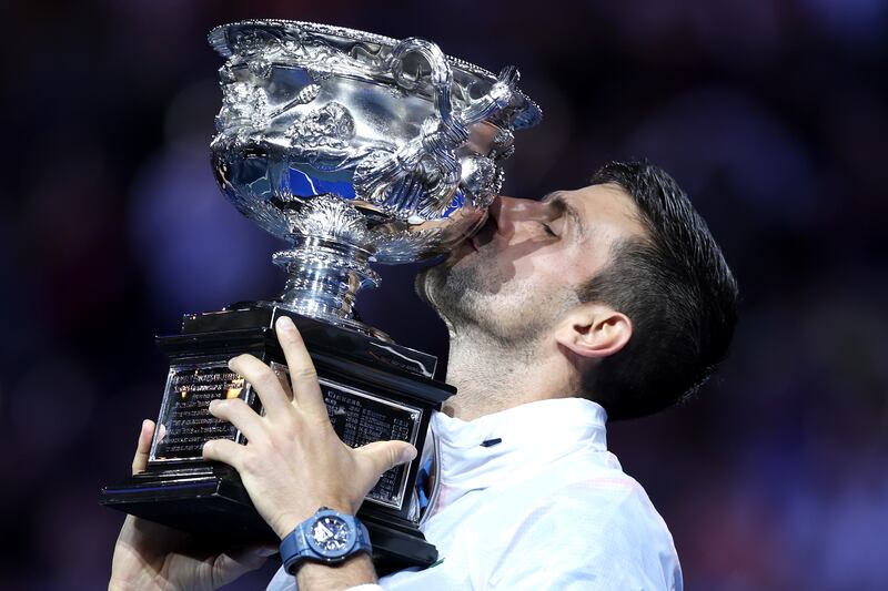 Novak Djokovic kisses the trophy. Getty 