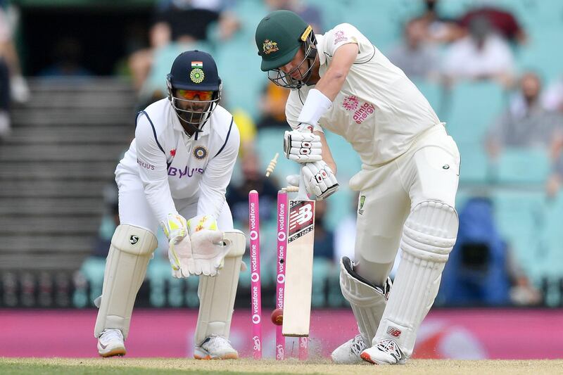 Australian batsman Pat Cummins is clean bowled by India's Ravindra Jadeja. AFP