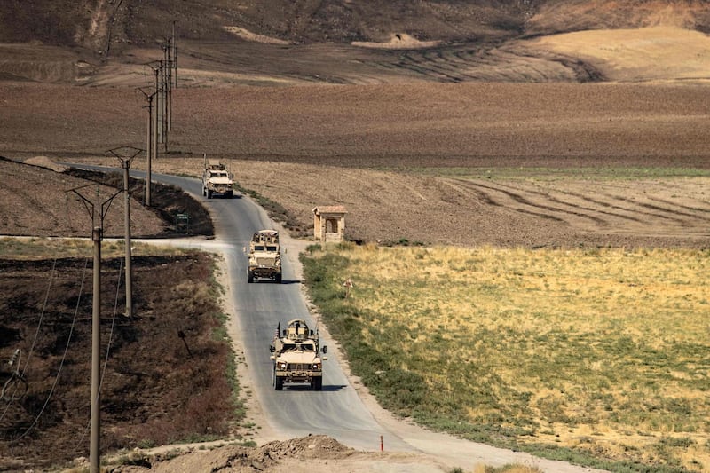 A US military convoy patrols near the Rumaylan oil fields in Syria's Kurdish-controlled north-eastern Hassakeh province on September 17, 2020, a day before the US said it was sending more troops and vehicles to north-east Syria. AFP